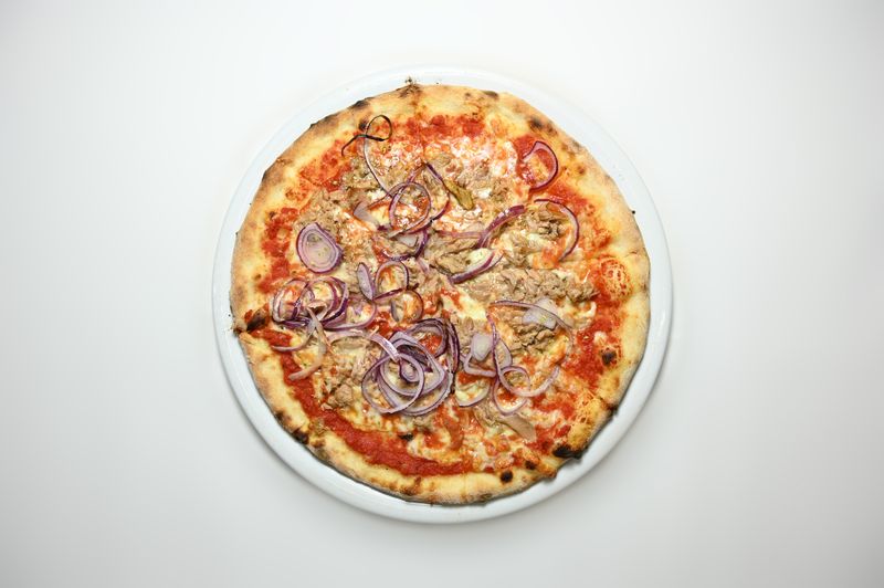 BBQ Chicken punch pizza with smoky sauce and red onion