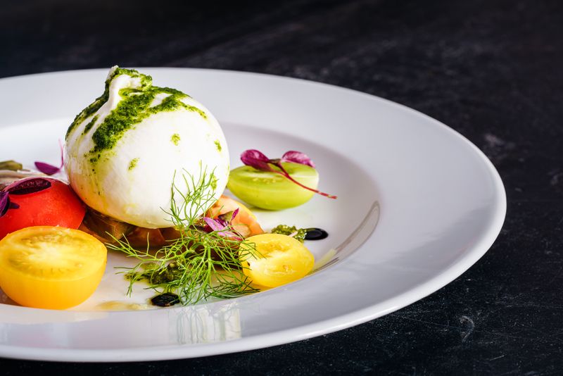 Burrata with heirloom tomatoes and basil pesto starter