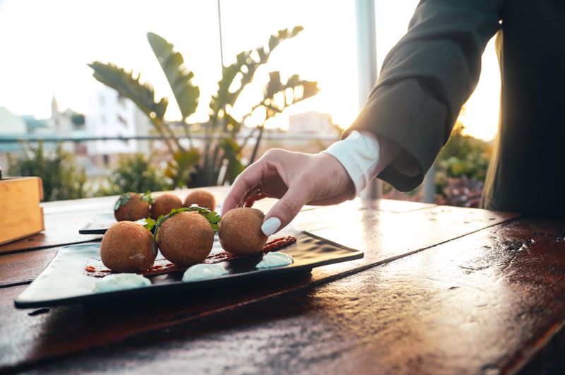 Arancini rice balls with mozzarella and marinara