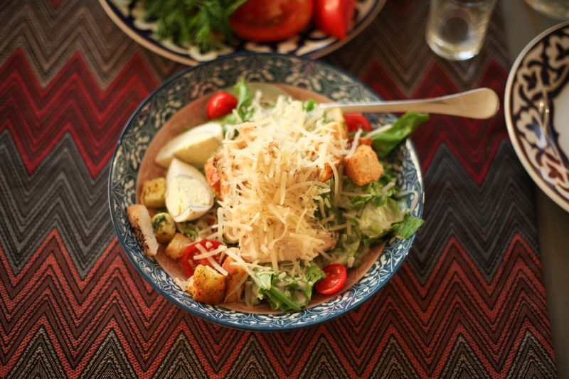 Classic Caesar salad with house dressing and parmesan