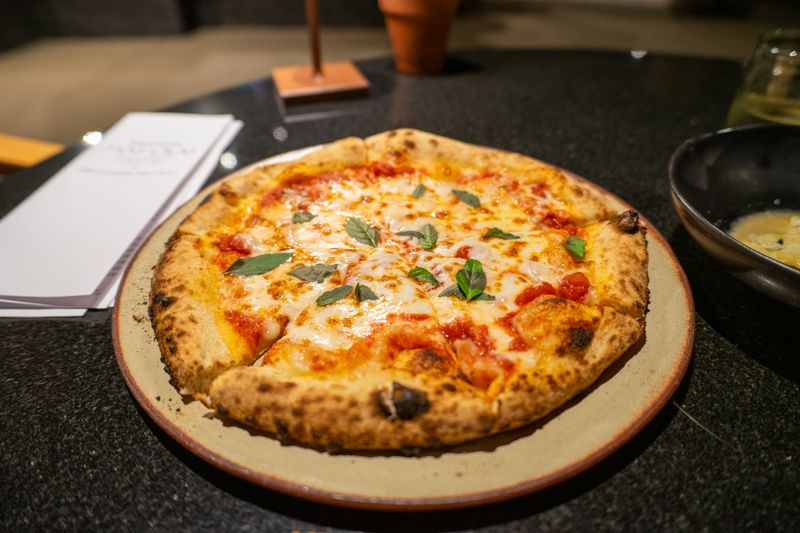 Punch Classic Margherita pizza with fresh mozzarella and basil